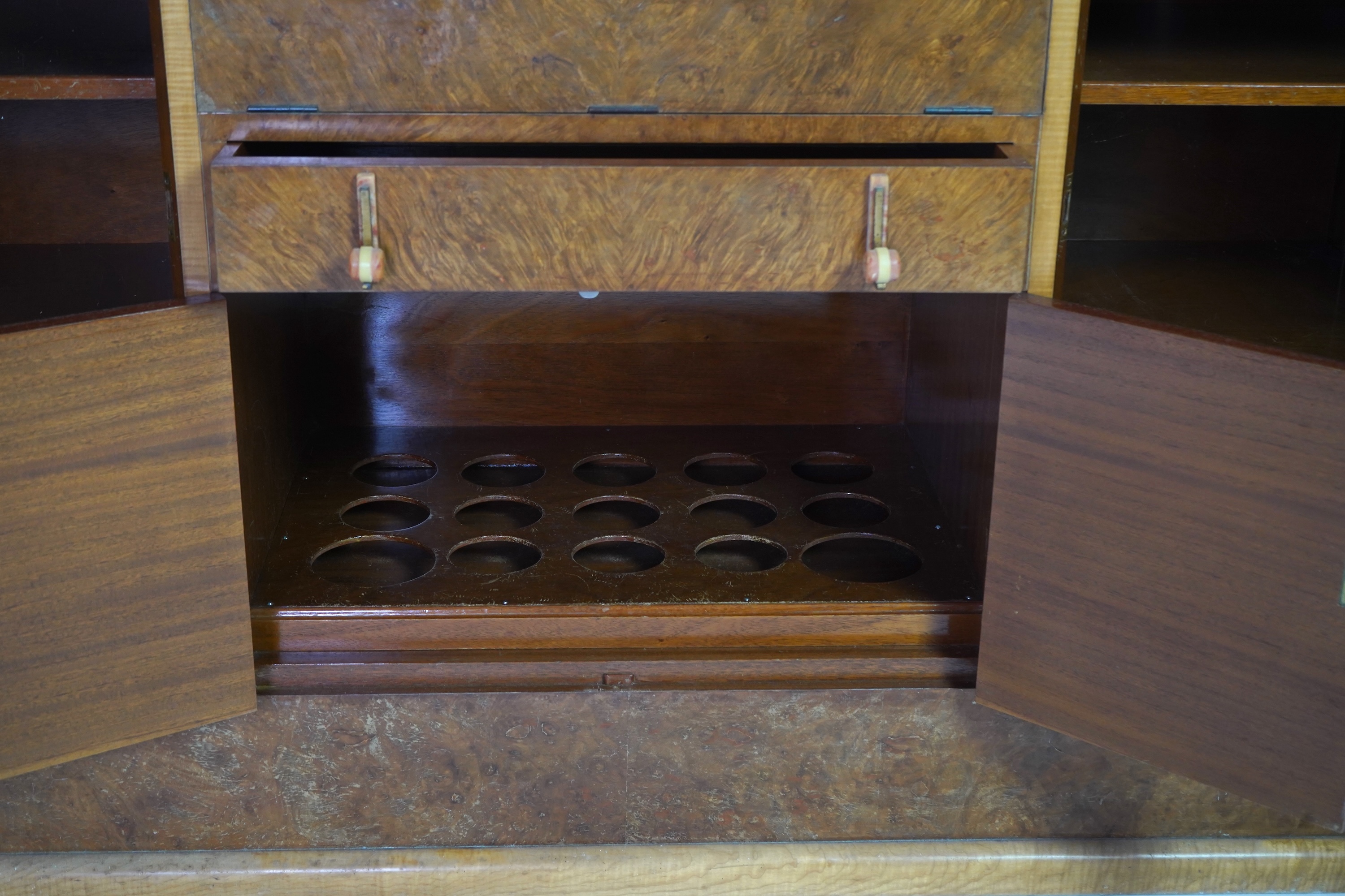 Attributed to Harry and Lou Epstein: An Art Deco burr walnut dining suite